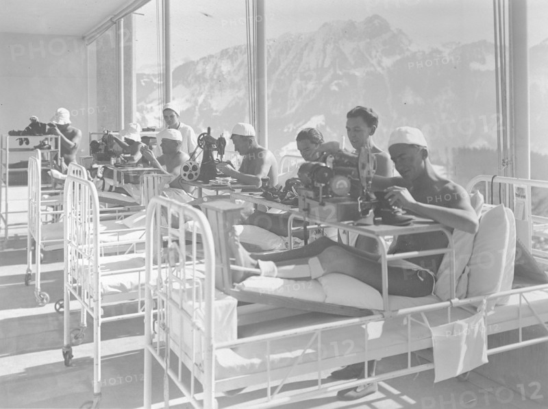 Leysin: patients in a sanatorium sawing shoes, ca. 1935.