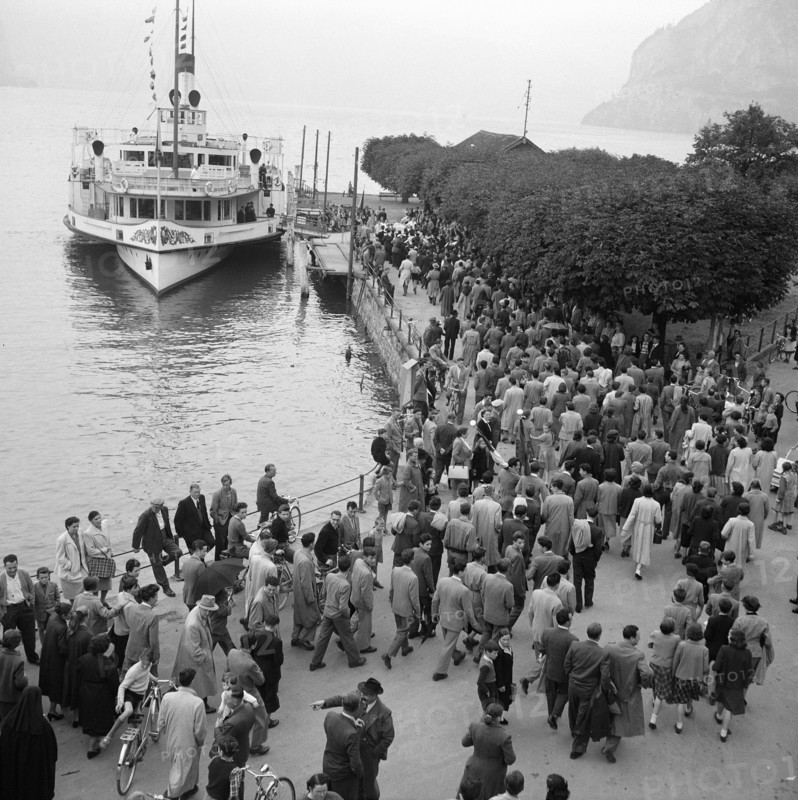 People at landing stage in Ticino, 1953.