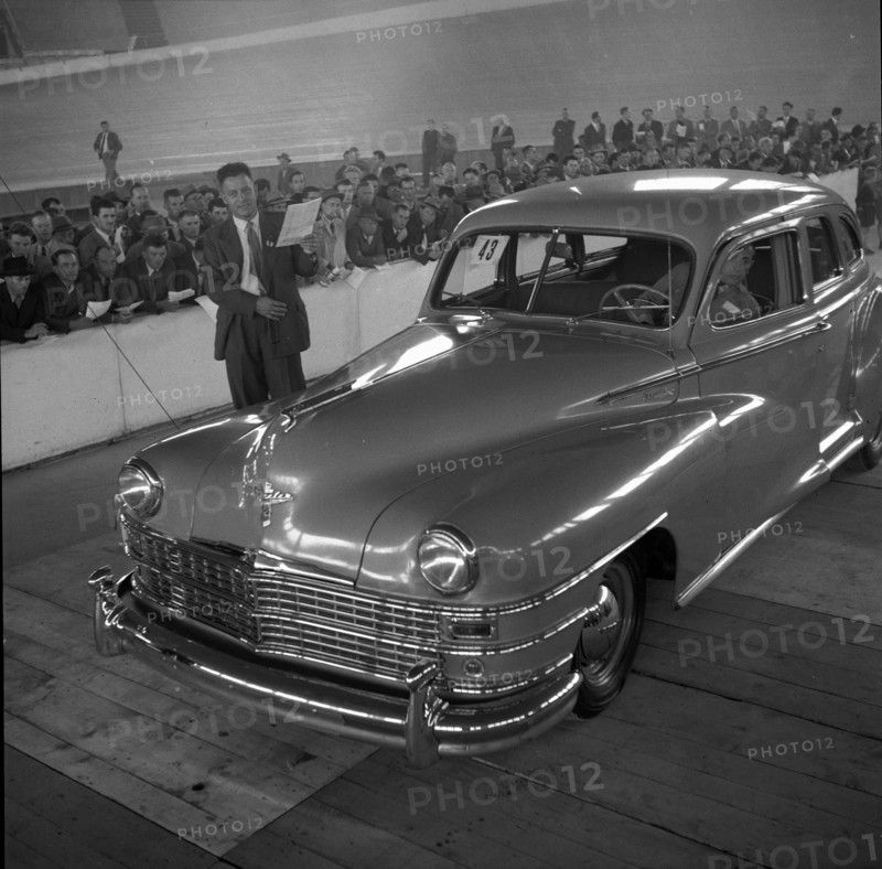 Auctioneer auctions Chrysler; 1955.