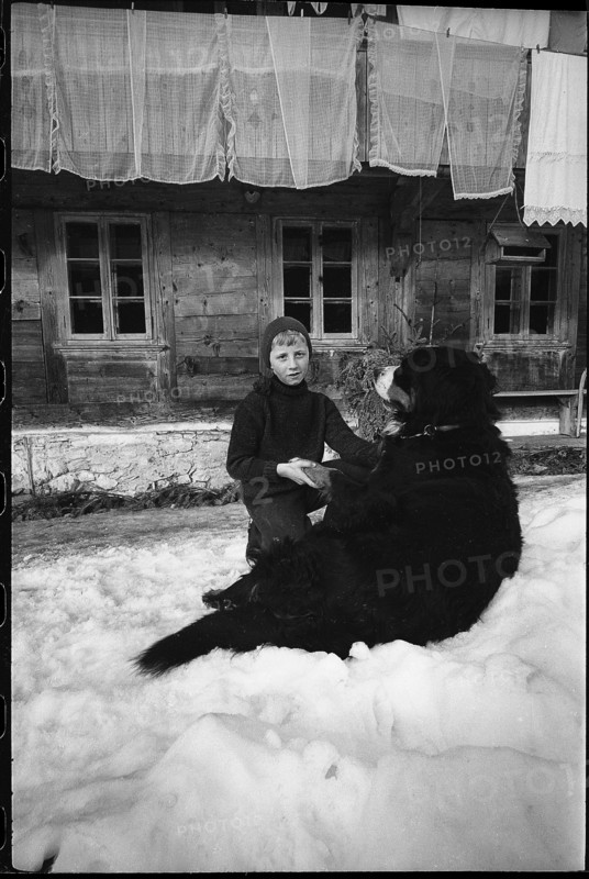 Boy with dog in the Emmental, 1970.