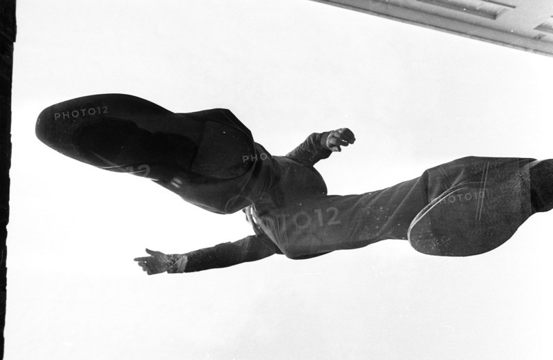 Man standing on glass, photographed from underneath, 1969.