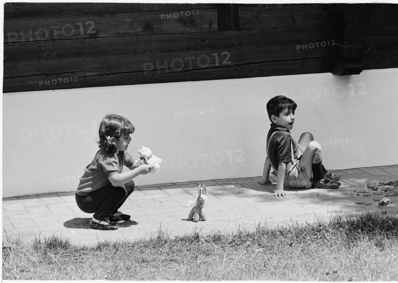 Farahnaz and Reza Cyrus Pahlavi playing in Gstaad, 1966.