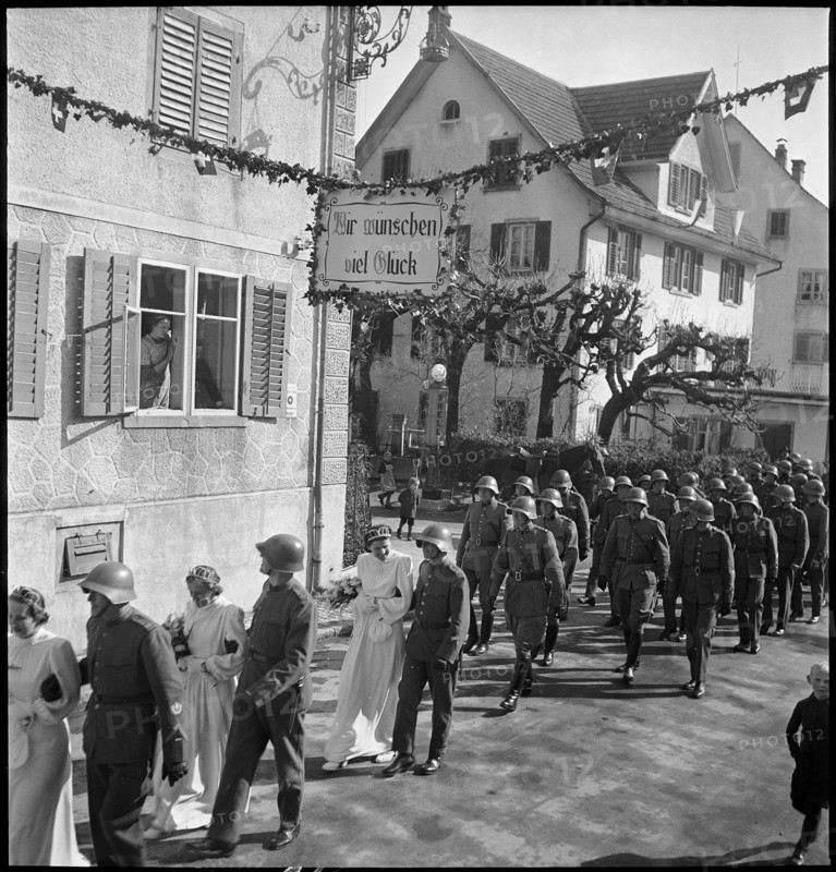 Soldiers' wedding; three wedding couples passing through village; 1941.