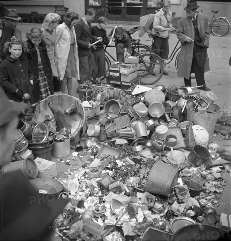 Collect of non-ferrous metal; pile of metal articles; 1942.