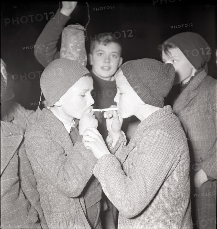 Boys smoking at the end of the school semester.