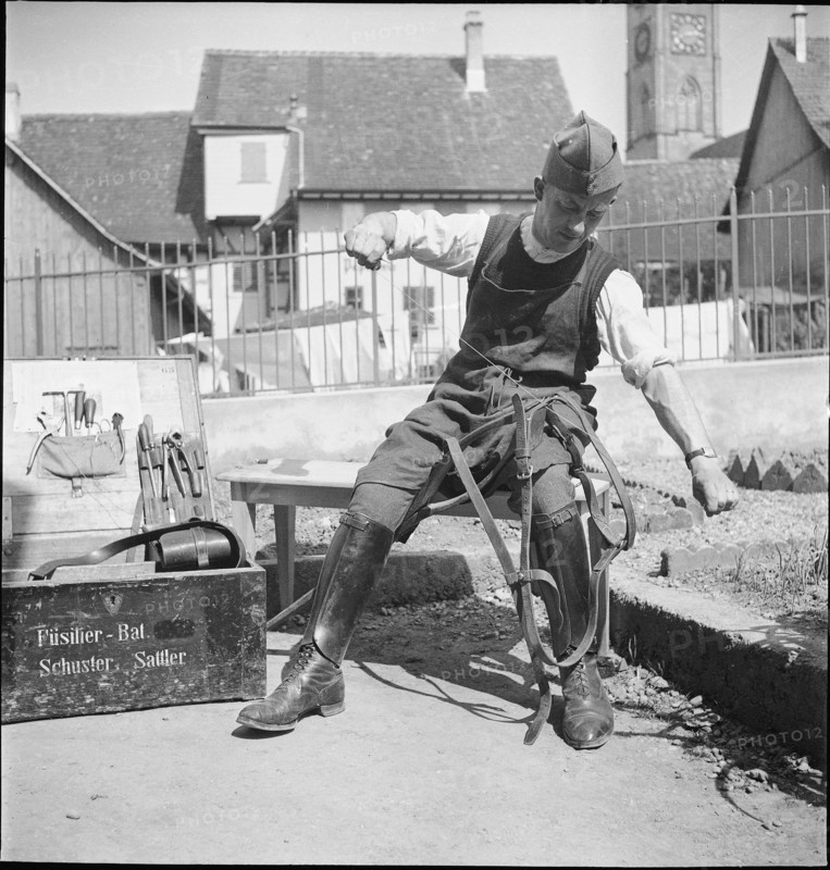 WW 2: soldier sewing, stitching horse harness, 1940.
