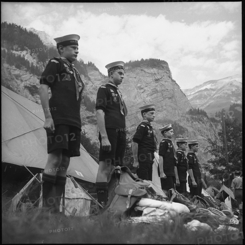English boy scouts standing at attention in Kandersteg, 1950.