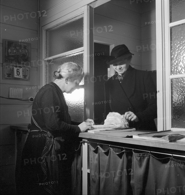 Woman selling embroideries, 1941.
