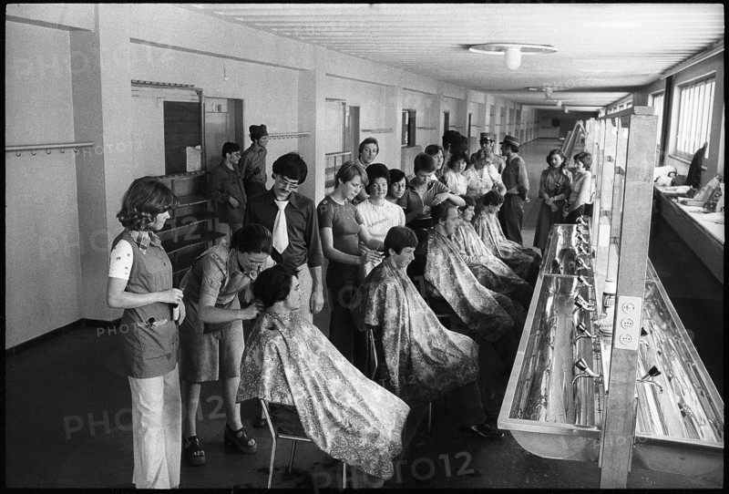 Hairdressers cutting hair of recruits 1975.