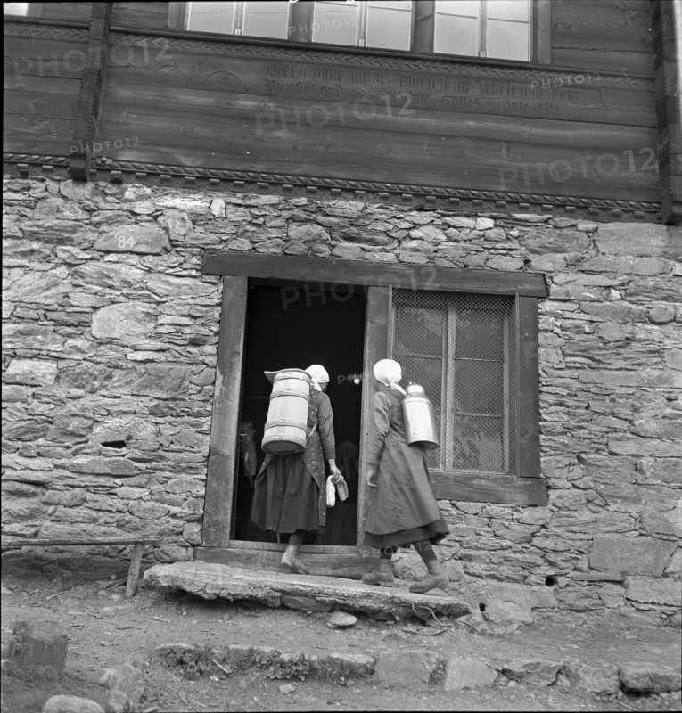 Lötschental, women carrying milk churn, 1941.