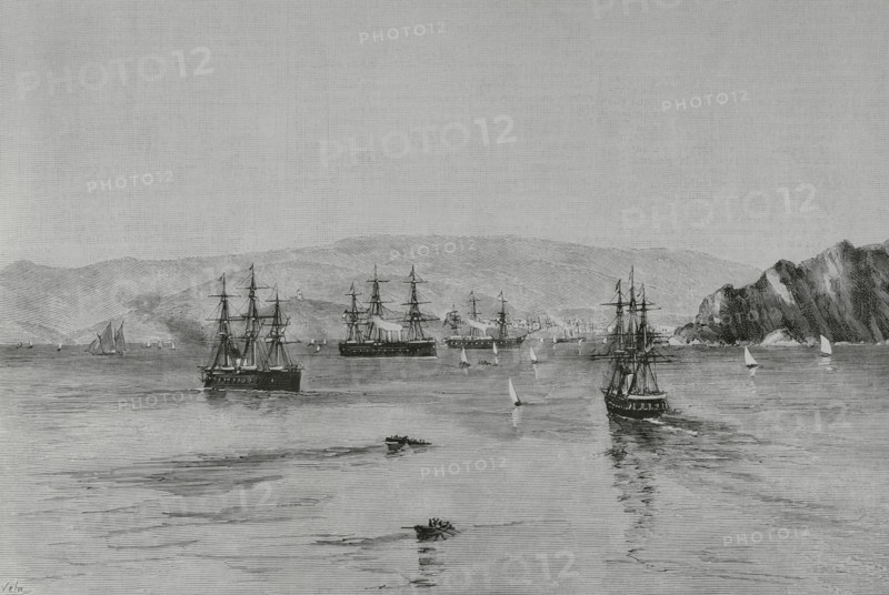 Journey of the Kings of Spain, Alfonso XII (1857-1885) and Maria Cristina de Habsburgo-Lorena (1858-1929), to the northwestern provinces. Gijon, Asturias. Arrival of the squadron at the port, to receive the kings on board. Drawing by A. de Caula. Engraving by Vela. The Spanish and American Illustration (La Ilustracion Espanola y Americana). September 30, 1884.