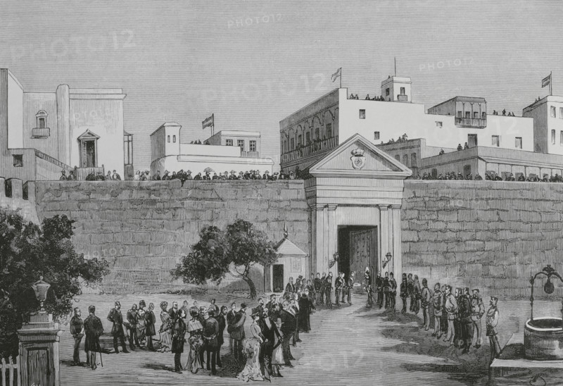 San Juan, Puerto Rico. Ceremony of assumption of office of the higher government of the island. It was costumary in the city for the new Captain General to make his public entrance, on his way to celebrate the ceremony, through the Gate of San Justo, before which the Acting Governor General presented him with the Keys of the City, as a sign of homage and obedience to his orders. Presentation of the Keys of the City to the new Governor-Captain General of Puerto Rico, Mr Ramon Fajardo Izquierdo (1826-1888), in front of the Gate of San Justo, on 19 September 1884. Engraving by Vela. The Spanish and American Illustration (La Ilustracion Espanola y Americana), 1884.