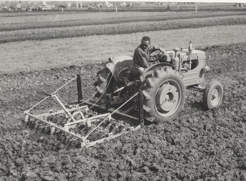 Fiat 25 R Diesel tractor equipped with harrow