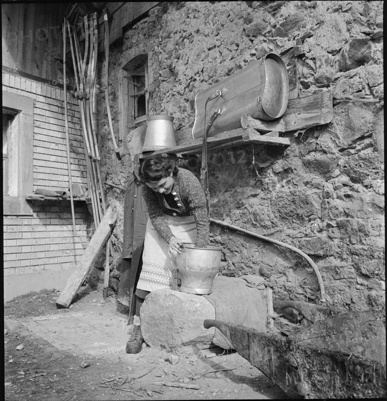 WW 2: farming camp; volunteer doing cleaning work, 1939.
