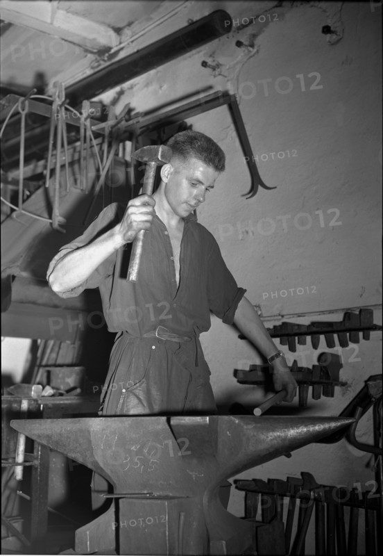 Blacksmith at the Anvil, 1950.