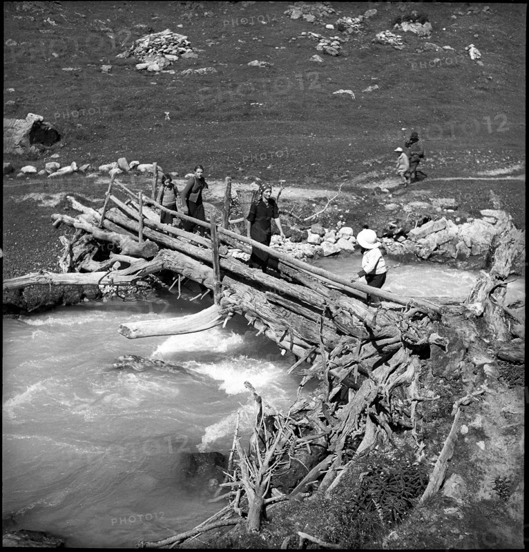 Farmers walk to the cheese donation in the Turtmanntal valley, Switzerland, 1940.