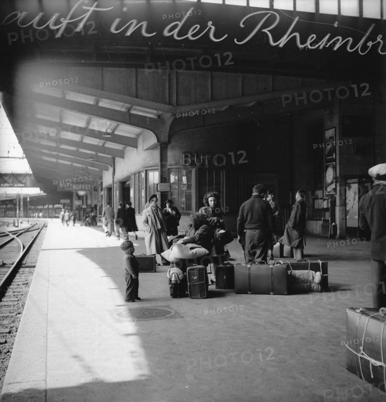 Passengers waiting for the train at Basel station, 1951.