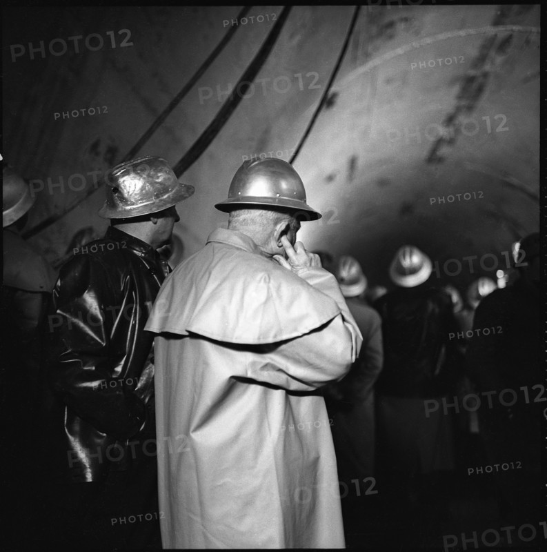 Tunnel breakthrough: man keeping his ears shut, Grand-St-Bernard 1962.