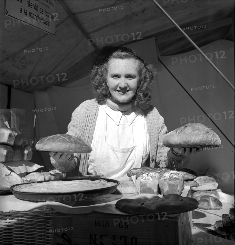 Baker with bread, 1949.