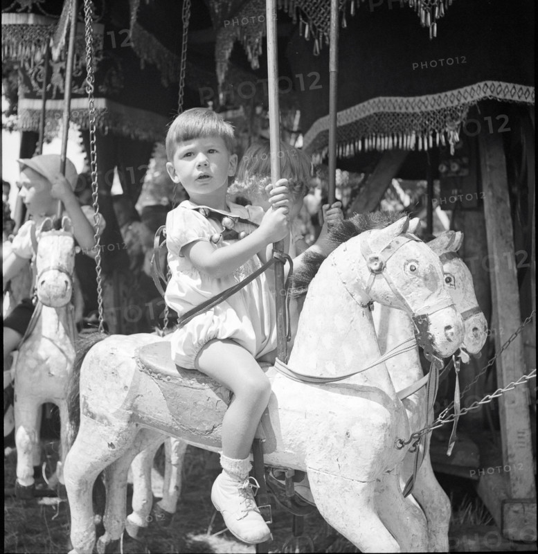 Boy on a merry-go-round, Lausanne 1942.