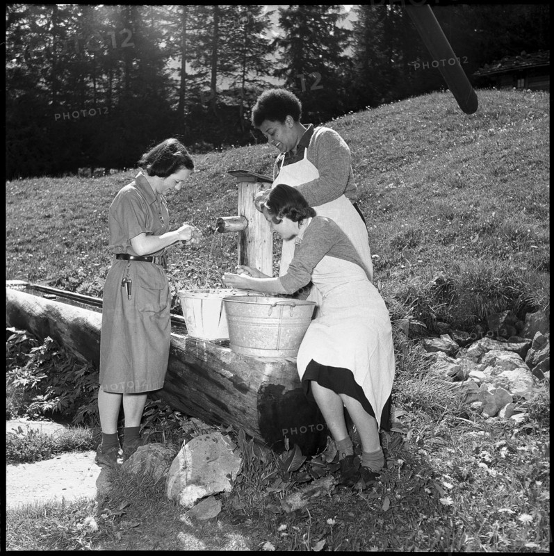 Girl scouts washing vegetables at the fountain, 1952.