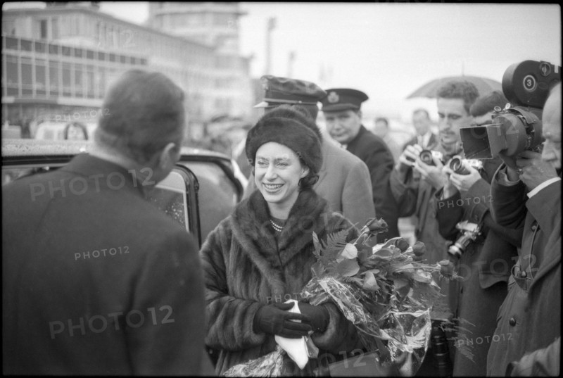 Margaret with the british consul general James Walsh (left); on her way to Davos.