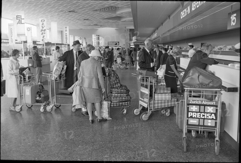 Tourists at airport Zurich-Kloten 1971.