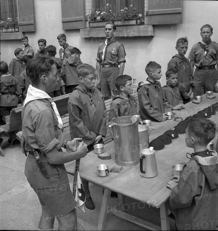 Together at the table with bread and drink.