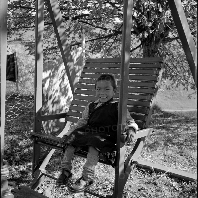 Tibetan child on swing, Unterwasser 1961.