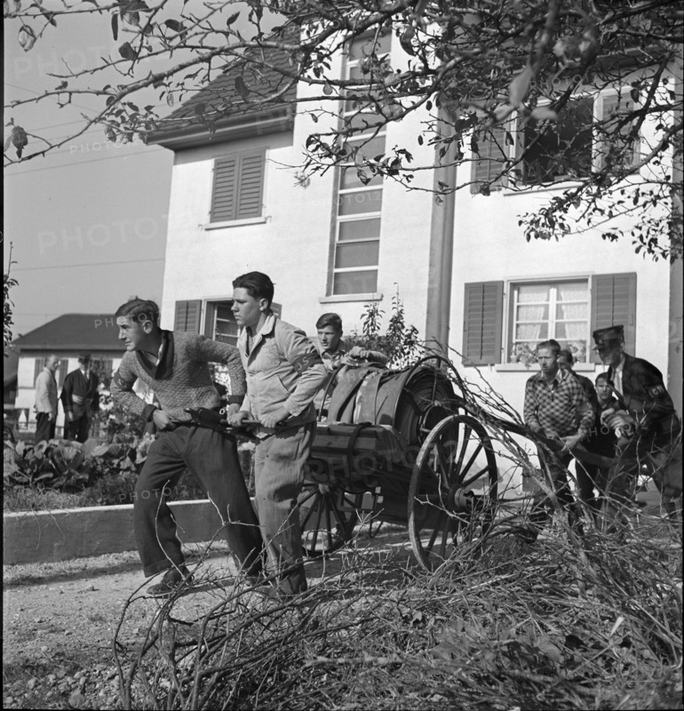 War fire brigade; men pulling hose cart; 1939.