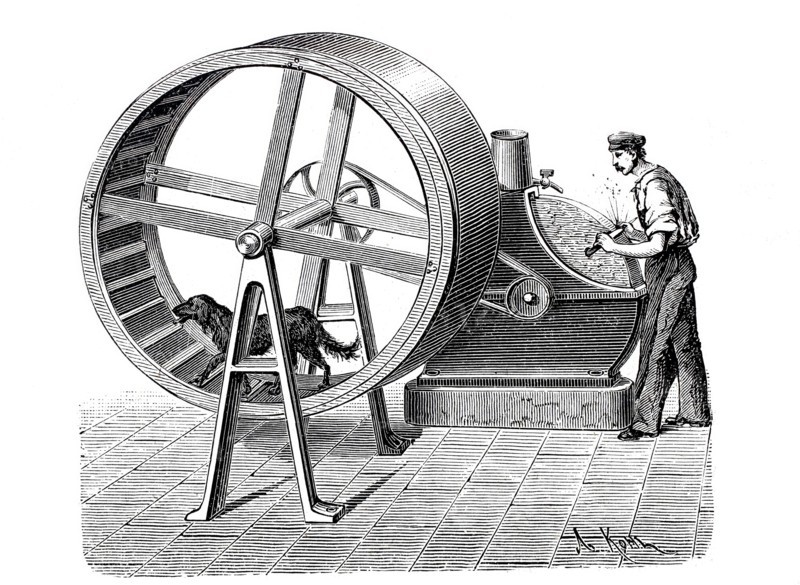 Dog driving a grindstone wheel.