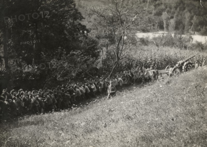Soldiers towing artillery