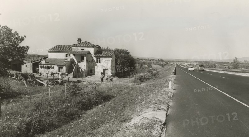 The Autostrada del Sole runs alongside Cascina Palestina near Monte San Savino.