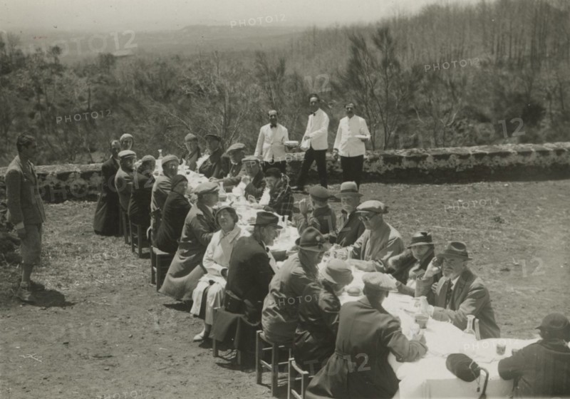 Group lunch outdoors. 
	
		1924
