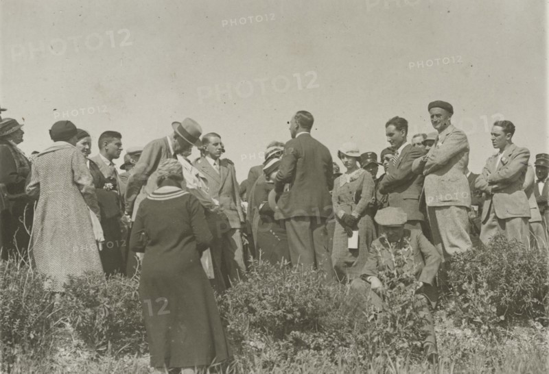 Listening to the guide. 
	
		1924