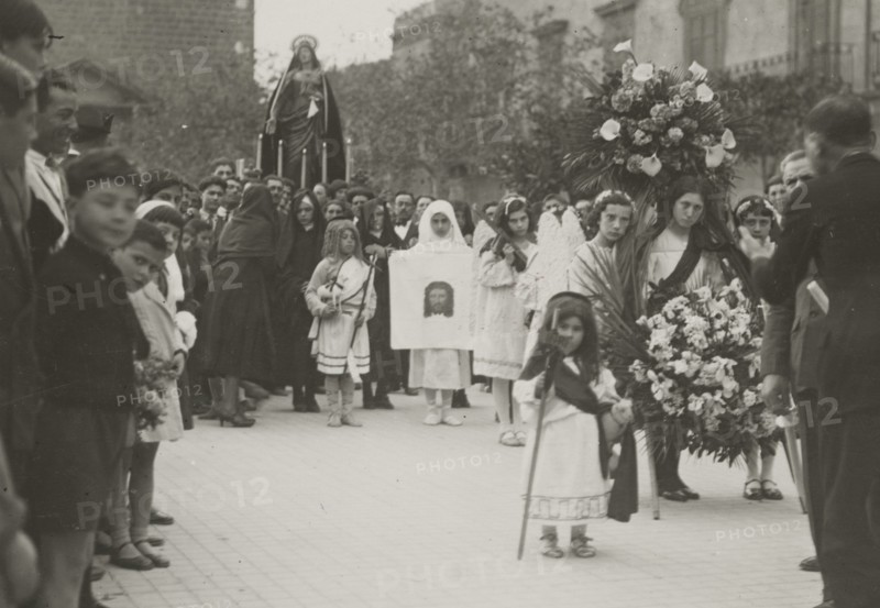 A procession. 
	
		1924