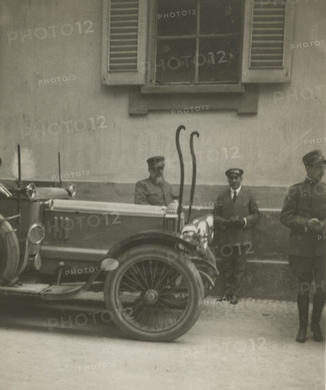 Frederick Johnson next to a car. 1915-1925