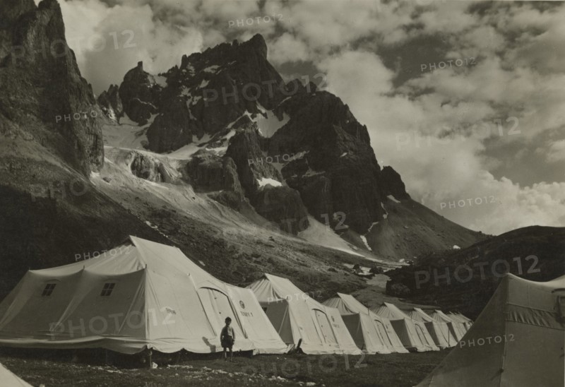 XIV Touring Club Italiano Campsite at the source of the Travignolo: tents at the foot of the Pale di San Martino. 1935