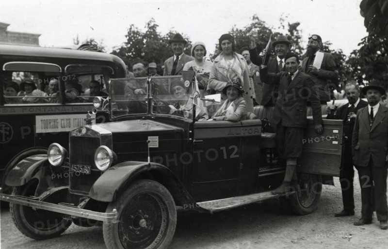 Members of the Touring Club Italiano  on board a car. 
	
		1931