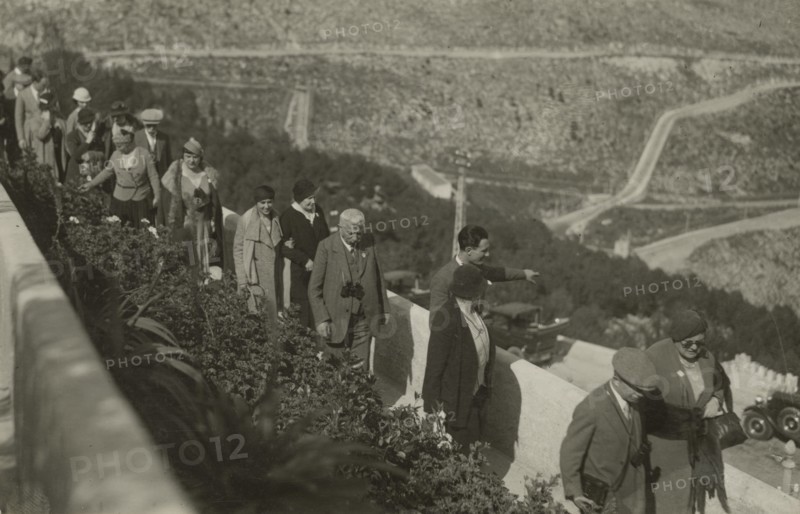 Members of the Touring Club Italiano stopping at a lookout point. 
	
		1924