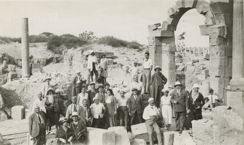 Excursionists in front of Trajan's Arch in Leptis Magna. 
	
		1931