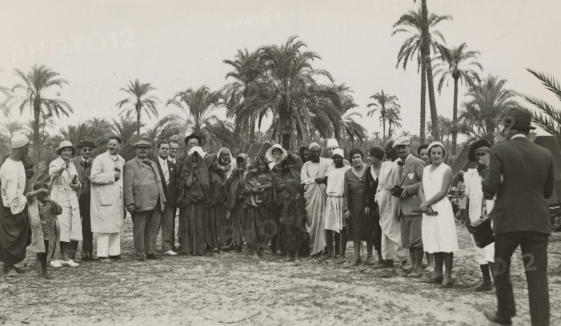 Excursionists in Libya together with some indigenous people. 
	
		1931