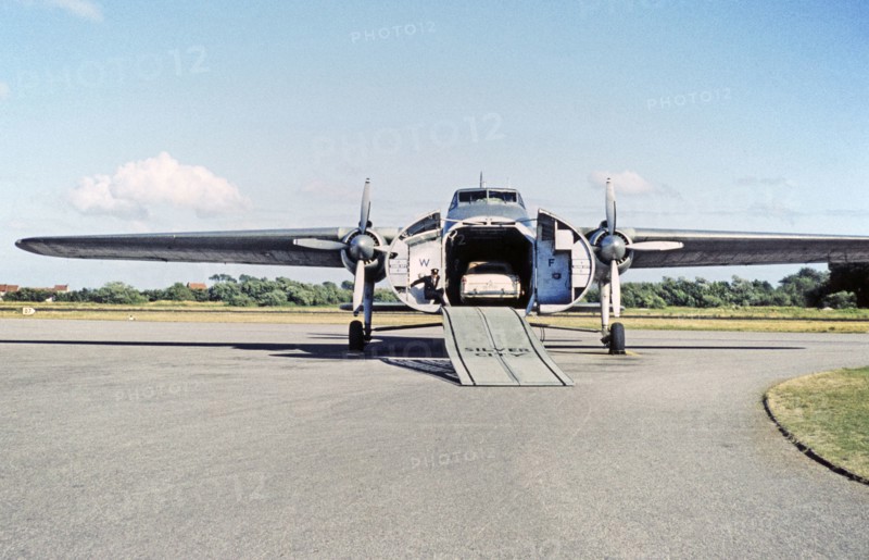 Silver City Airways air ferry, car loading onto Bristol Superfreighter plane, Ferryfield airport, Lydd, Kent England, UK 1959.