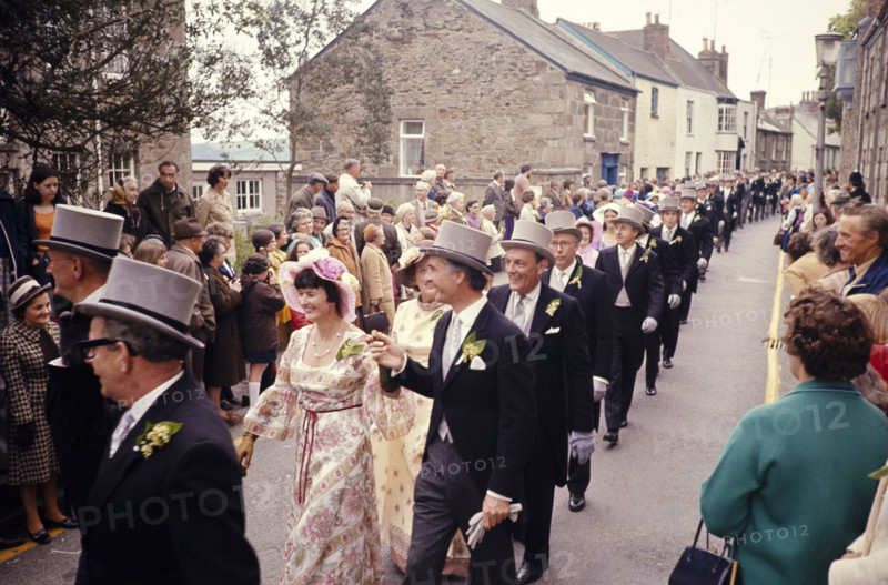 Flora Day, Helston, Cornwall, England, UK 1973 - crowds watch couples perform the  Furry dance in the streets of the town.