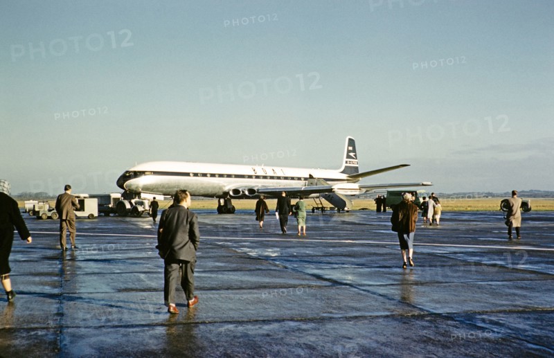 Passengers walking to board BOAC British Overseas Airways Corporation, De Havilland 106 Comet 4 jetliner plane, G-APDB,  early 1960s.