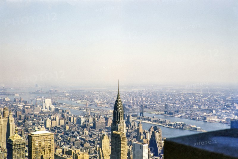 View from Empire State Building over Chrysler Building to East River, Roosevelt Island, Queensboro Bridge, Manhattan, New York, NY State, USA c 1953.
