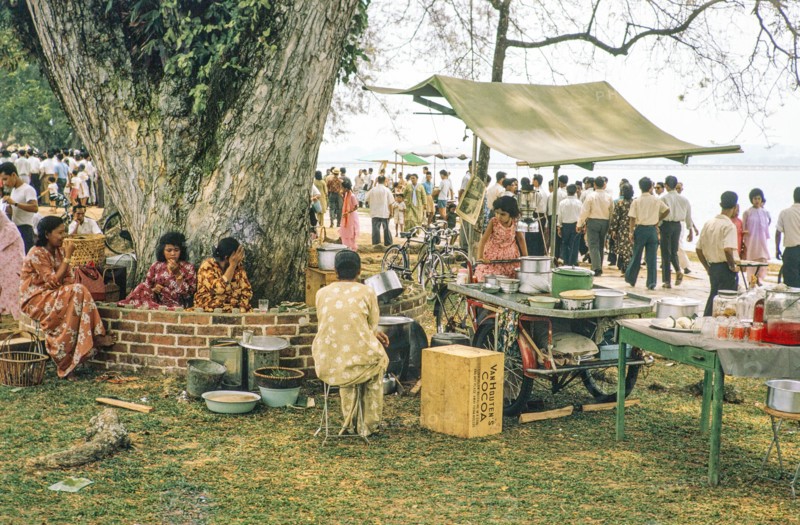 People celebrating having picnics, Waterfront, Johor Bahru, Malaysia, Southeast Asia 1963 - Mawlid festival commemorating the birthday of Islamic prophet Muhammad.