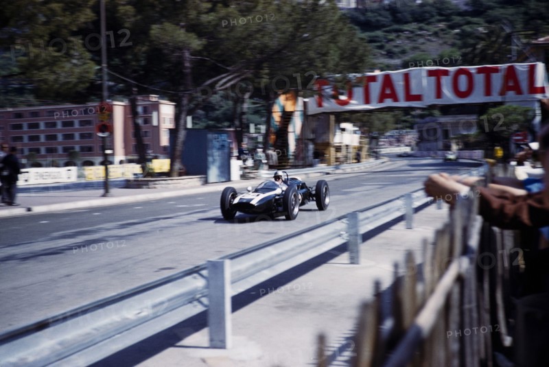 Formula One motor racing Monaco Grand Prix race 1961, Jack Brabham in Cooper-Climax racing car, passing pits.