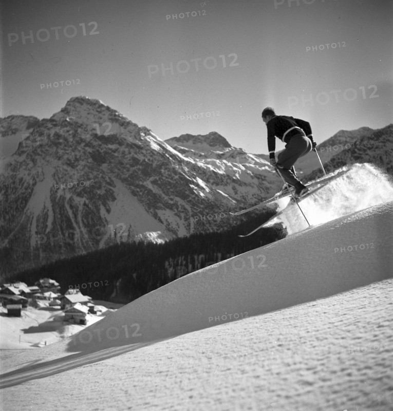 Ski instructor shows proper way to ski, jump, Arosa 1938