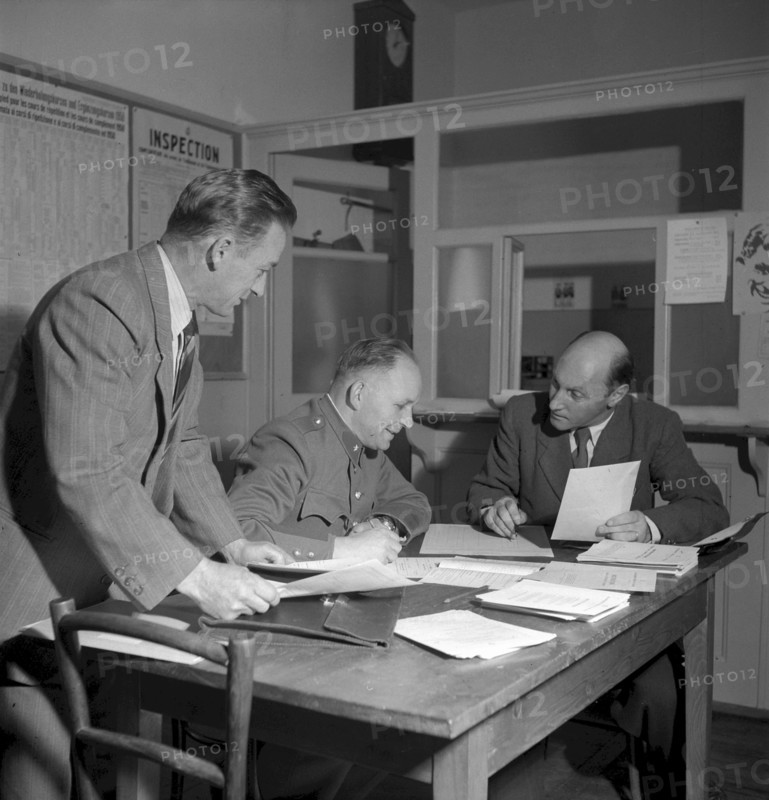 Census form control at the police station, Cully 1950
